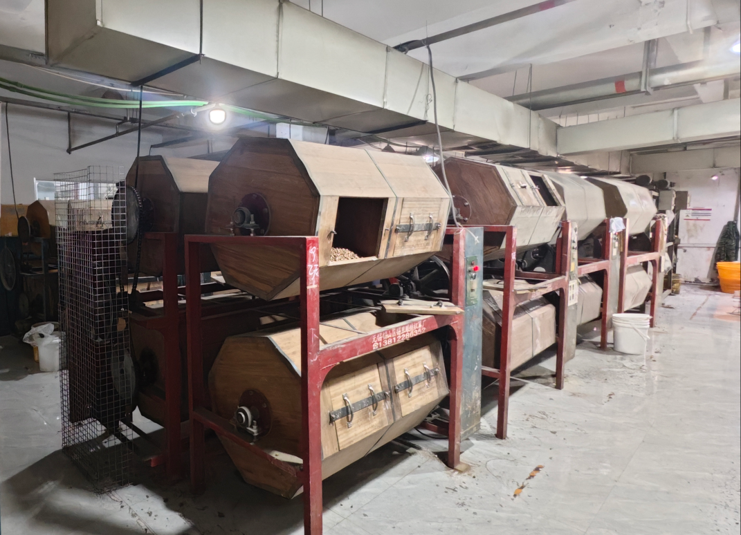 An inside view of a tumbling barrel, showing frames mixed with wooden media