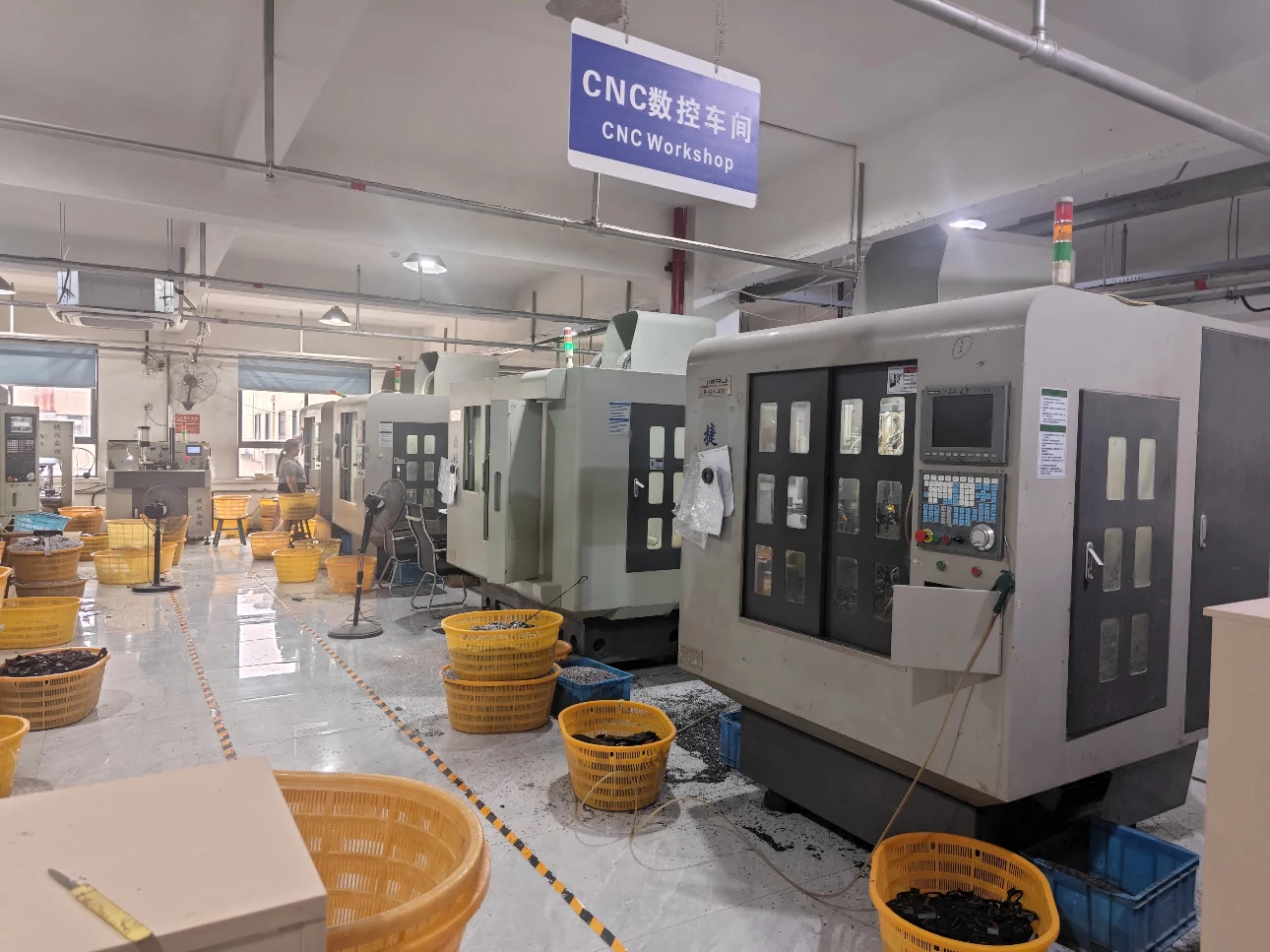 Advanced CNC machining workshop for high-precision manufacturing of optical frame components.